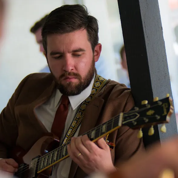 Joe Dampt playing a vintage guitar