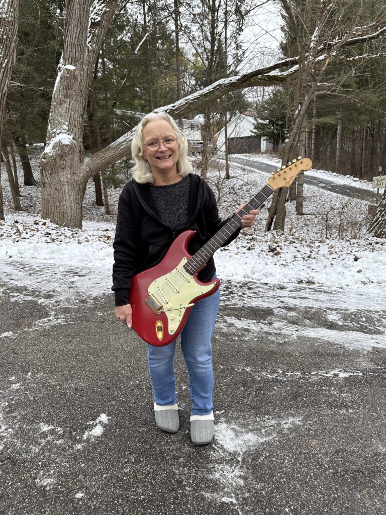 Mary’s 1963 Fender Stratocaster in Dakota Red with gold hardware