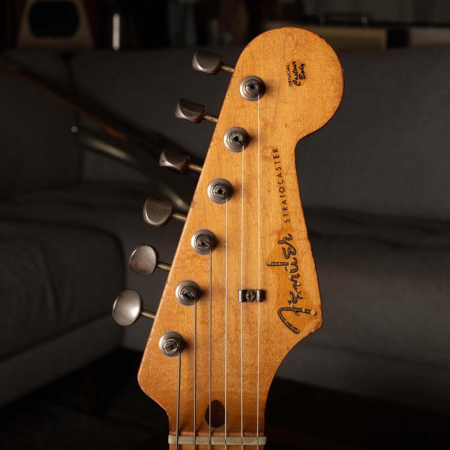 Head Of A Vintage Fender Stratocaster With Sunburst And Custom Finishes